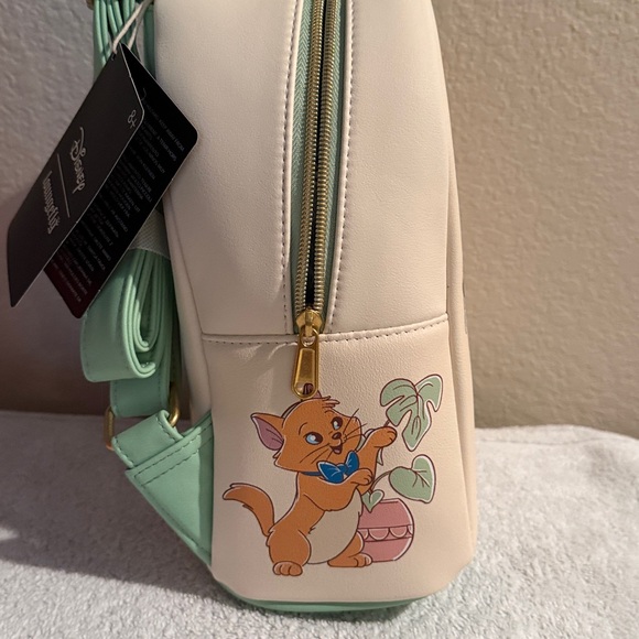 Loungefly Cream and Mint Pet-Themed Backpack by Disney Loungefly.  10Lx8Dx5W - Picture 4 of 5